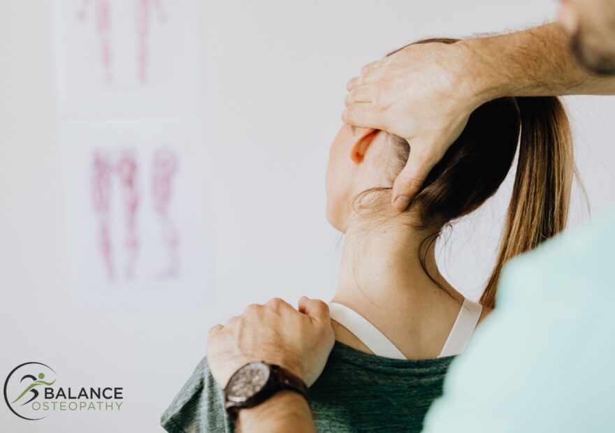 Osteopath assessing neck movement for neck pain in Melbourne