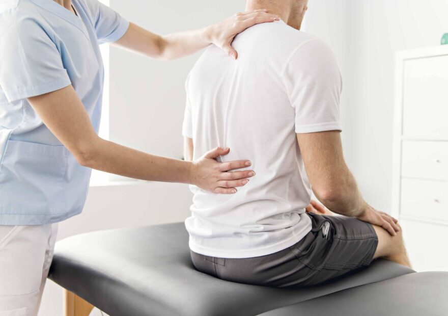 Osteopath treating a patient with back pain at Balance Osteopathy Melbourne